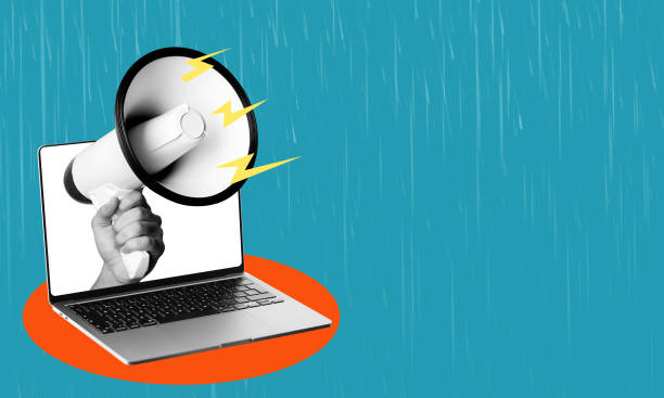 istock Art collage, laptop, and megaphone on blue background with copy space. 1542519979
