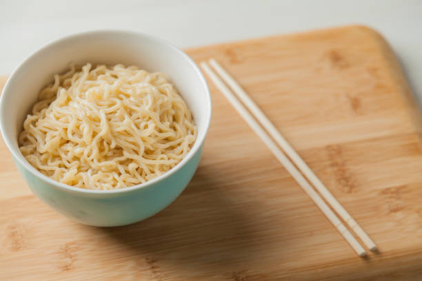 istock Ramen noodles in a bowl and chopsticks. 1542519982