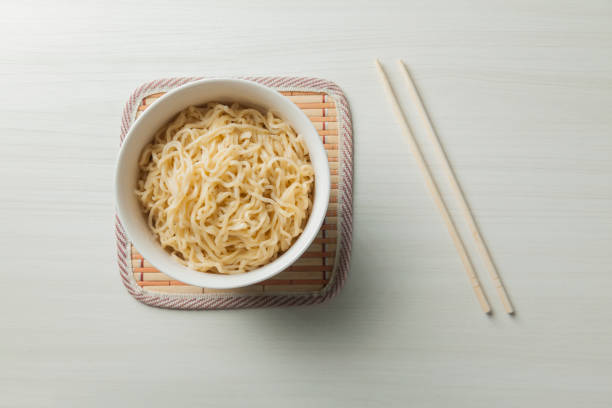 istock Ramen noodles in a bowl and chopsticks. 1542524796