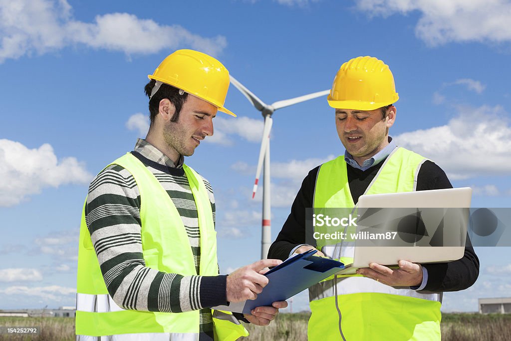 Two Engineers at Work in Wind Turbine Power Station 30-39 Years Stock Photo