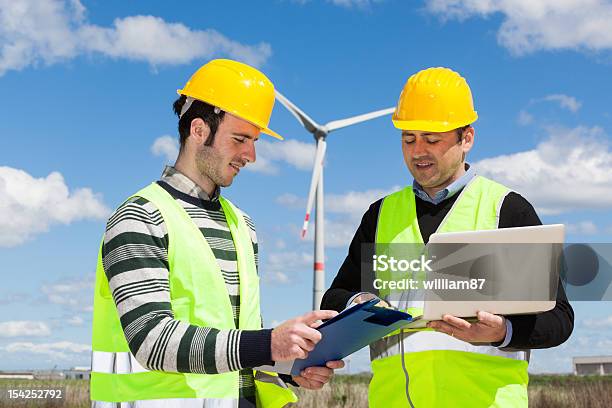 Two Engineers At Work In Wind Turbine Power Station Stock Photo - Download Image Now