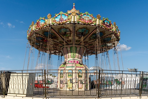 Newcastle upon Tyne, United Kingdom – June 21, 2023: A traditional funfair ride carousel at The Hoppings summer fairground or showground in Newcastle upon Tyne, UK.
