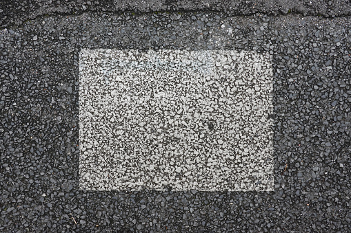 white square drawn on asphalt ground