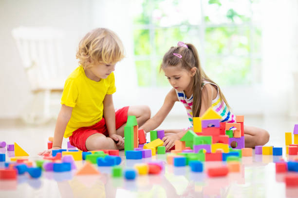 istock Child playing with toy blocks. Toys for kids. 1542564005