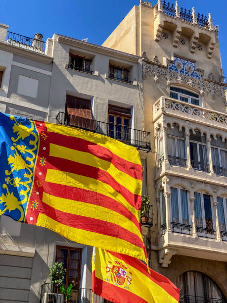 istock Valencian and Spanish flags waving outdoors 1542564489