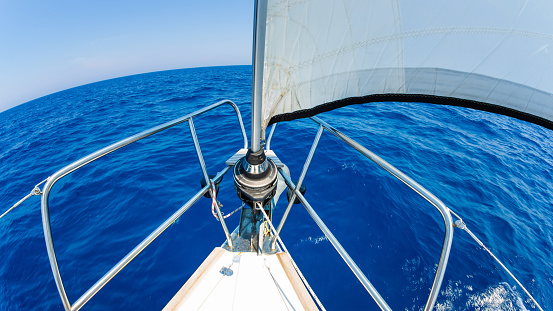 Sailing with sailboat, genoa roller furling system.