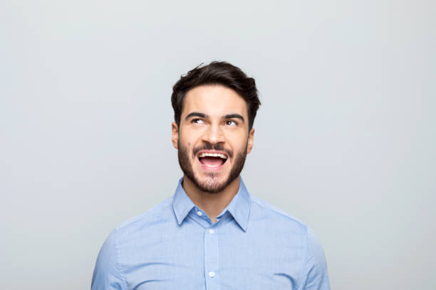 istock Headshot of surprised young businessman 1542565712