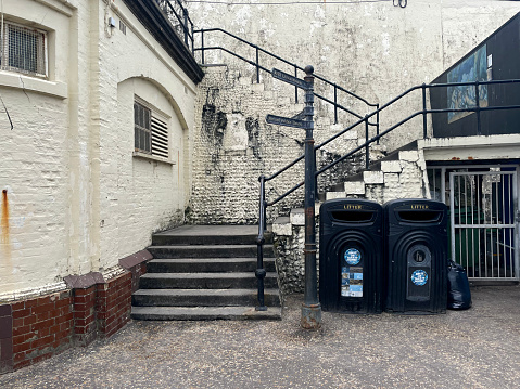 Grubby staircase and rubbish bins at Cromer in Norfolk