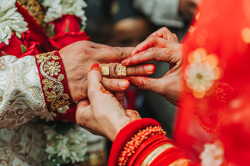 Hindu Bride and groom Performing wedding ring ceremony according to Hindu culture.