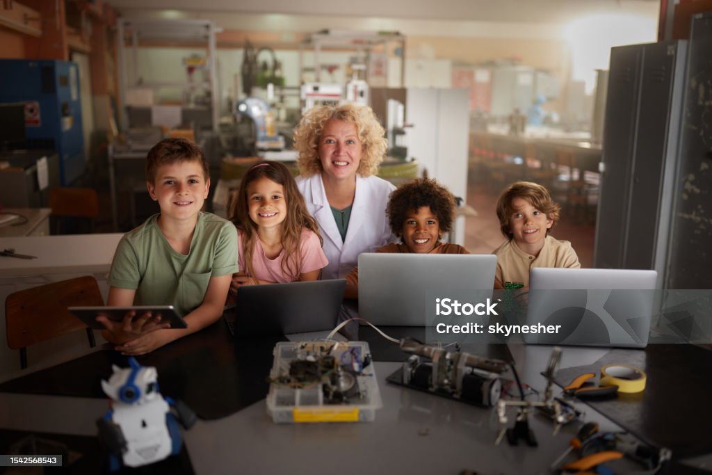 Little Programmer Happy Female Teacher And Her Little Programmers In Laboratory Stock ...