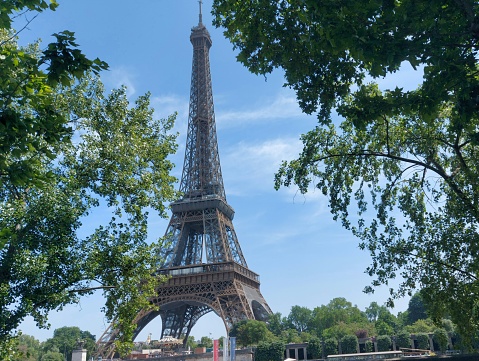 Paris, France. Monday 20 July 2020. Eiffel Tower behind a bus stop for Bosquet - Rapp