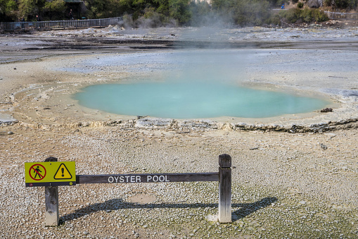 Oyster pool and sign at Wai-O-Tapu Geothermal Area, New Zealand.
