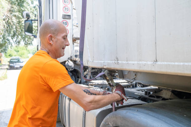 istock A big truck driver with his truck. 1542586703