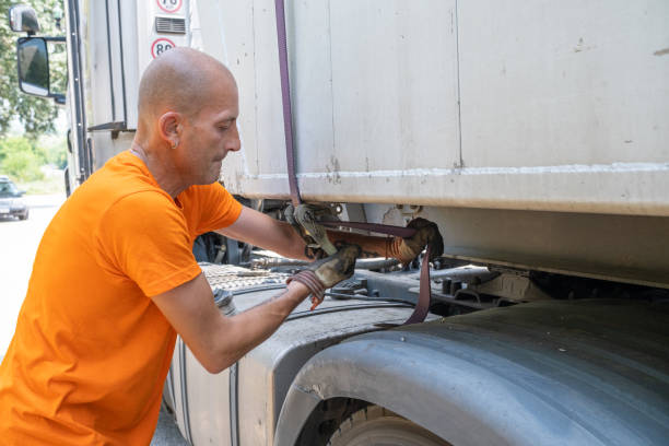 istock A big truck driver with his truck. 1542586706