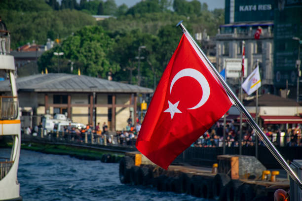istock Turkish flag in the foreground and Istanbul ferry 1542613275