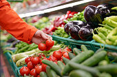 Man shopping vegetables in groceries store