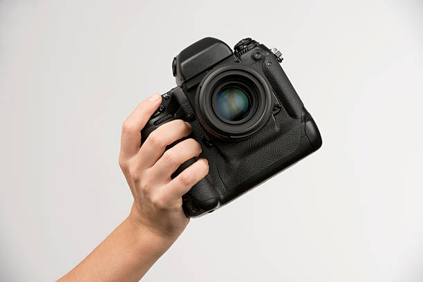 Black camera in hand stock photo