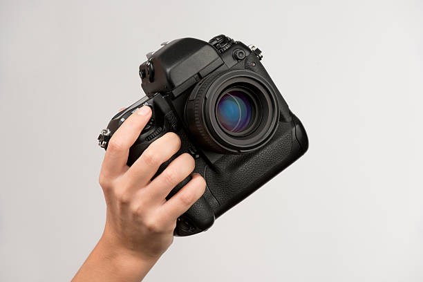 Black camera in hand stock photo