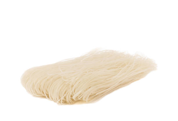 istock Dried raw rice noodles isolated on white background. 1542656523
