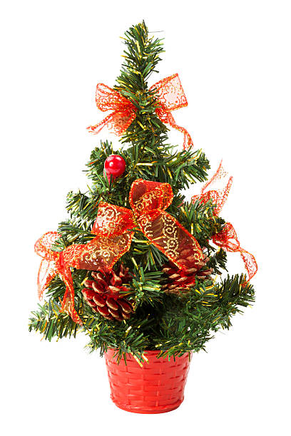 istock small christmas tree with bows and cones over white background 154265972