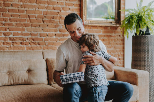istock Child handing gift box on father's day 1542664905