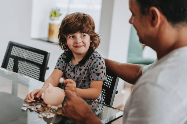 istock Father and son coin bank 1542666064
