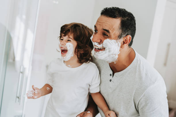 istock Father and son having fun shaving father's day 1542667141
