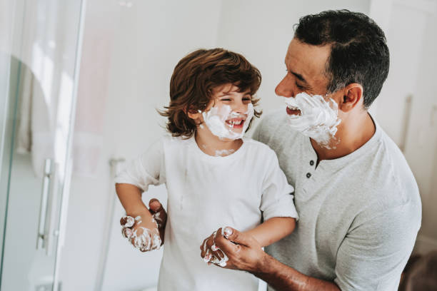 istock Father and son having fun shaving father's day 1542667158