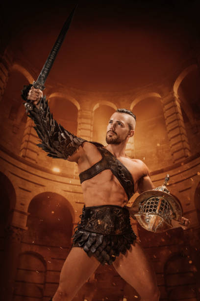 istock A Warrior Roman Gladiator holding a weapon in a colosseum setting 1542669846