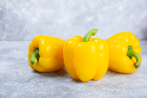 Fresh colorful bell pepper on marble background. Bell pepper. Vegetables. Vegan food. Healthy foods. Place for text. Place to copy. Diet concept.