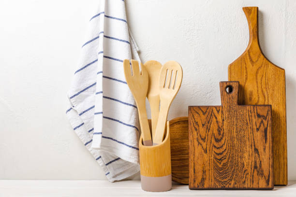 istock Cutting board on a textured  kitchen table. Menu food card or recipes background concept.MOCKUP. Design. Place for text, copy space. The concept of food and cooking. 1542678981