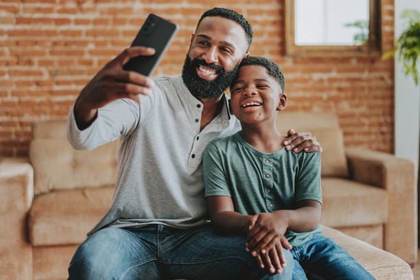 istock Father and child son making selfie with smartphone 1542678983