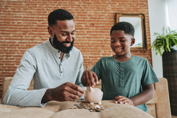 istock Father and son coin bank 1542679122