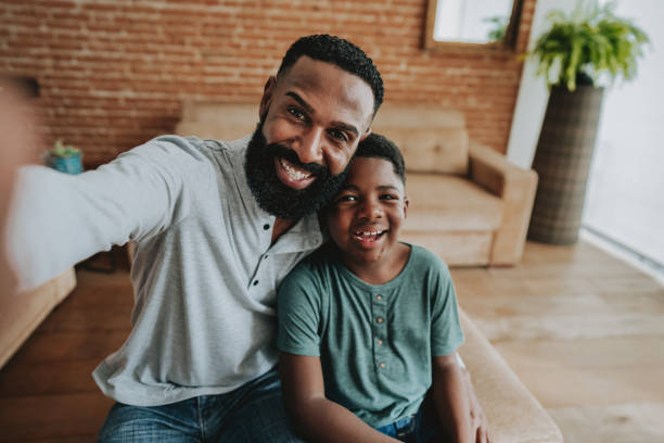 istock Father and child son making selfie with smartphone 1542679492