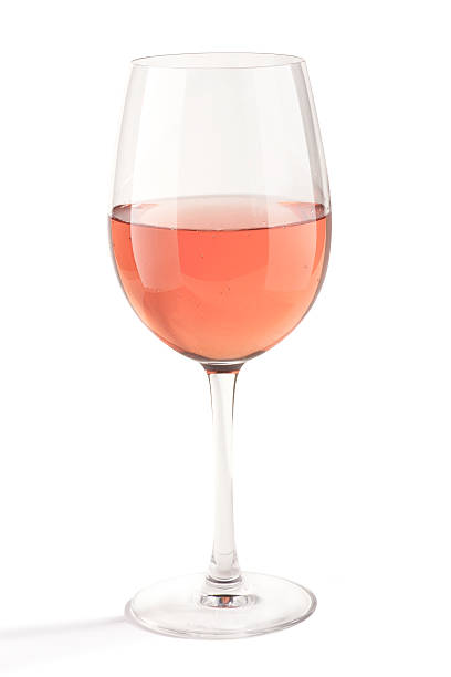 Rose Wine Glass A single glass of pink wine in a large stemware on a white background rose wine photos stock pictures, royalty-free photos & images