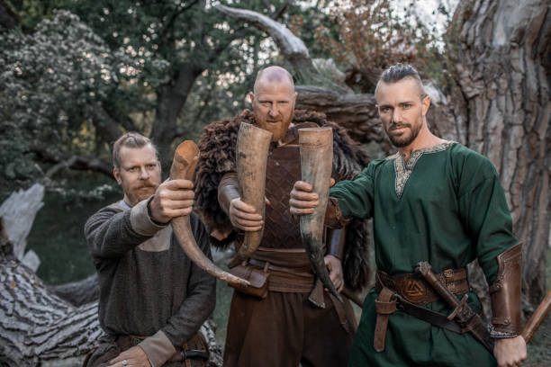 istock Three viking warriors enjoying a drink in an autumnal forest 1542681679