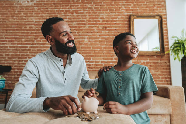 istock Father and son coin bank 1542684964
