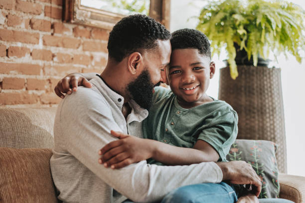 istock Father hugging son child boy 1542686915