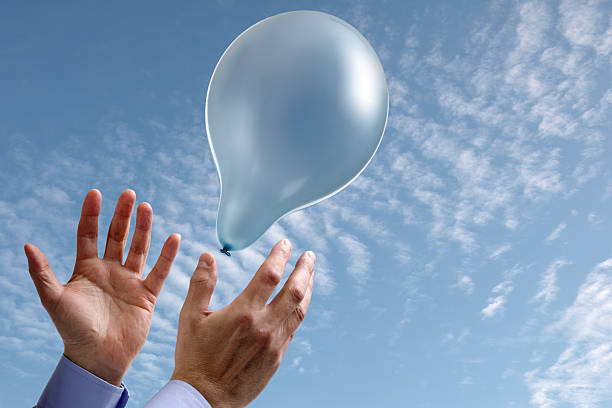 istock Aspirations concept with hands and balloon 154268834