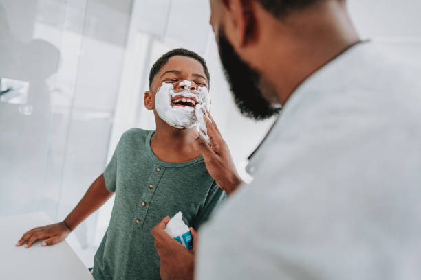 istock Father and son having fun shaving father's day 1542692665