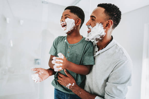 istock Father and son having fun shaving father's day 1542693733
