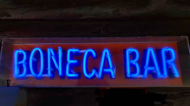 istock boneca bar - reads the blue neon lighted sign. 1542696948