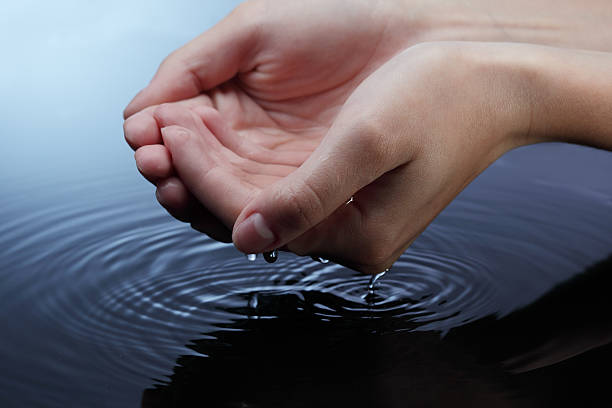 istock water  in woman hand 154271743