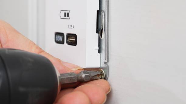 istock Installation of a USB Type-C socket at the head of the bed for charging devices. 1542738005