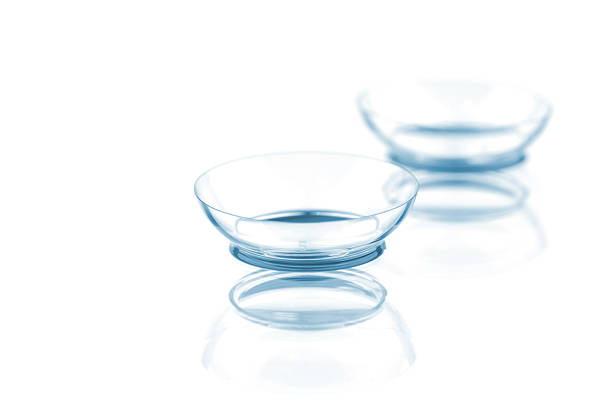 Contact lenses Two contact lenses with reflections, isolated on a white background contact lens photos stock pictures, royalty-free photos & images