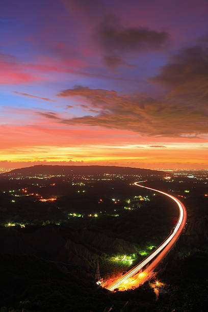 istock highway in the night with amazing sunset 154274219