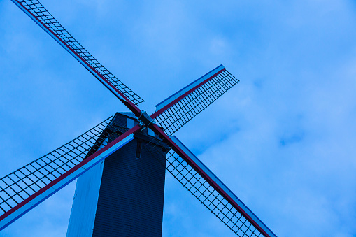 Working windmill against a blue sky
