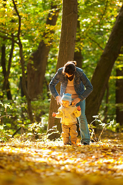 istock Mother with baby in the park 154276862