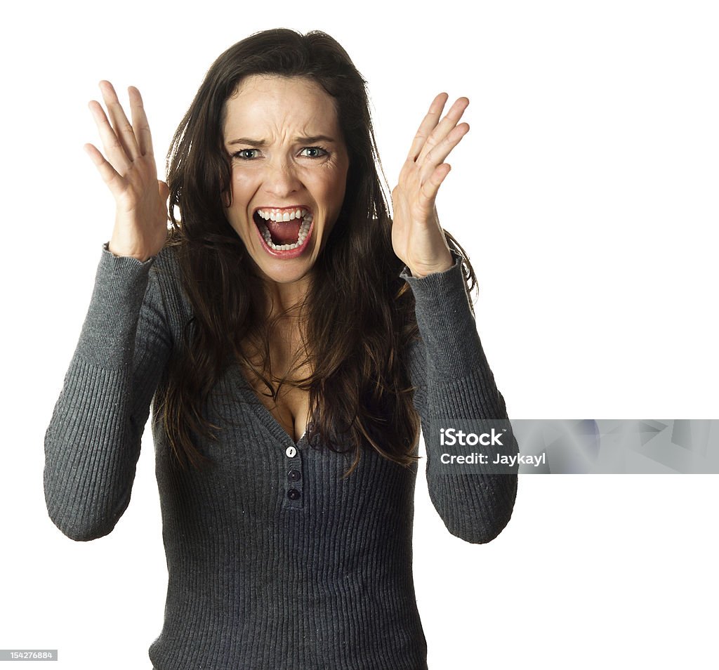 Very frustrated and angry woman A very frustrated and angry woman screaming. Isolated on white. Adult Stock Photo