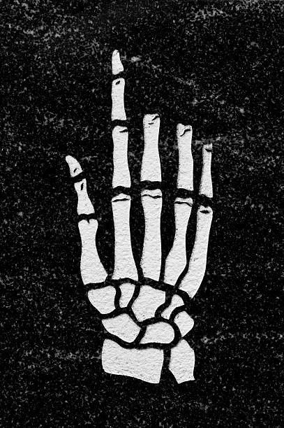 Skeleton Hand in Black Granite stock photo